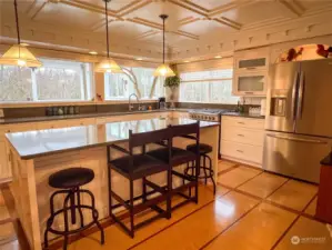 Chef kitchen with new appliances and amazing island design. Custom features abound. Easy to tell that the creator of this kitchen is also a master cabinet maker. So many hidden storage features!