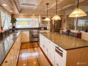 Chef kitchen with new appliances and amazing island design. Custom features abound. Easy to tell that the creator of this kitchen is also a master cabinet maker. So many hidden storage features!