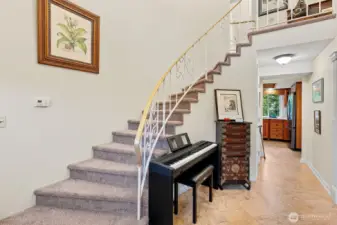 Foyer with dramatic staircase to the upper level