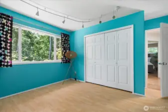 Nice size closets for storage in this room as well as lovely windows looking out to the trees and forest nearby.
