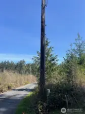 property corner/power pole. property on right.