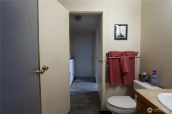 Guest bath leading to the laundry/back door