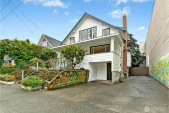 Parking and personality, this home has it all! Personality is somewhat easy to come by in Seattle, but four or five off-street parking spaces are a rarity. Murals are by local artist Michael O'Driscoll.