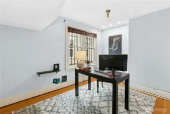 This main-level room is the first of the four bedrooms. While it has no closet, the nook could easily be outfitted as a closet.