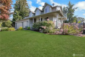 Welcome to this large 5 bedroom home with a 3 car garage & Wrap Around porch!