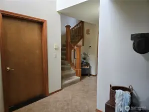 Door to the garage and Staircase to the upstairs.