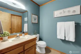 1/2 bath on the main floor also has the laundry closet.