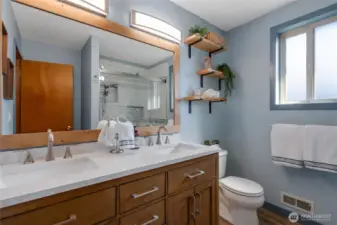 Tiled shower in Upstairs Hall Bath.