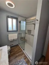 Tiled shower in Upstairs Hall Bath.