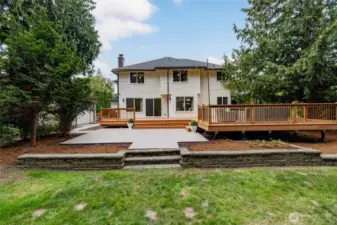 Situated on a level 1/3 acre lot, the fenced backyard features a new wood deck spanning over 600/sf, paver patio, a garden shed, and plenty of room for play, pets, and entertaining.