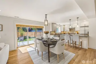 Spacious dining area to gather and eat, as well as access to the back yard.