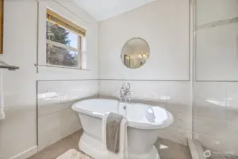 Full primary bathroom with perfect soaking tub.