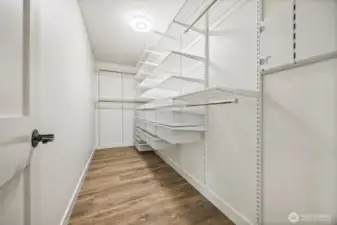 The primary bedroom's walk-in closet is fully customizable to move and shift drawers and shelves to fit your needs.