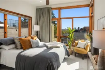 The primary suite captures city views, wrapped in natural light and calming modern design.