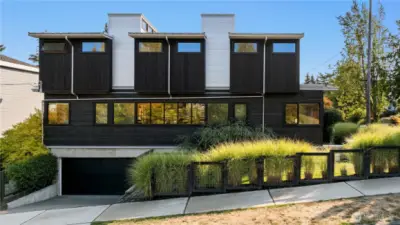The rare 2-car attached garage anchors the modern design while ensuring everyday convenience.