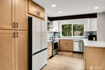 Amazing updated kitchen with all new soft close cabinetry, quartz counters, and new appliances!