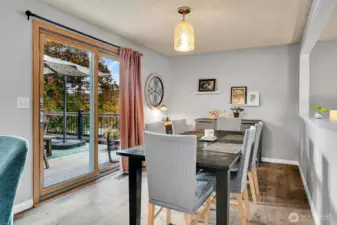 The dining room offers ample space and opens directly to the spacious deck—perfect for entertaining or outdoor dining.