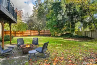 Out back, the fully fenced yard provides space to relax, garden, or give pets room to play.