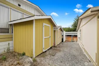 Multiple storage sheds included.