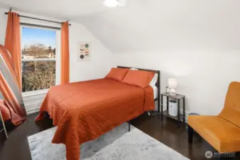 Unit #2015: This sunny second bedroom is adjacent to the bathroom at the top of the stairs.