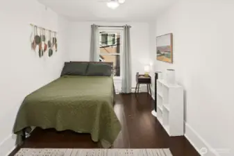 Unit #2015: The upper level has original fir floors, highlighted here in the third bedroom.