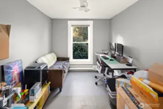 Unit #2011: The middle upstairs room, used as a home-office by current tenants, looks out over the yard - just wait until that rhododendron pops into bloom!