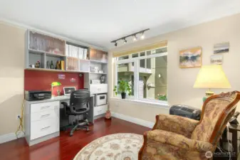 The second bedroom is serviced by a full bath with tile accents.