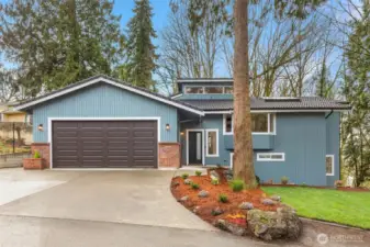 Fresh exterior paint, new garage door, and landscaping create instant curb appeal