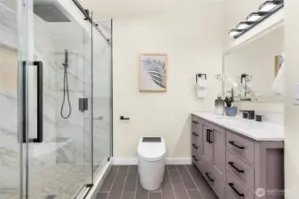 Beautifully updated primary bath with soaking tub, large shower and generous walk-in closet
