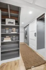 The finished lower level with a separate entrance offers flexibility or potential rental use, plus excellent storage & a large capacity wine cellar perfect for aging your collection. The sliding barn door on the right leads to the boiler room with extra storage space and a separate room with a wine cellar.  A consistent cool temperature all year round is the perfect environment to store your wine collection.