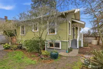 The back exterior of the home has a side porch and garden area on the sunny south side, great for summer vegetable gardening. The lower-level has access from inside the home or could be used with a separate entrance for rental or MIL potential.