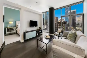 5th & Madison #2002 high ceilings, walls of windows and NW views.