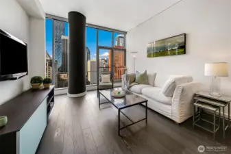 Dramatic window wall showcases city views with high ceilings to invite the light throughout.