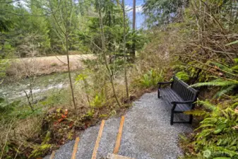 Upgraded stairs lead down to  the Snoqualmie River waterfront — perfect for enjoying the peaceful river setting.