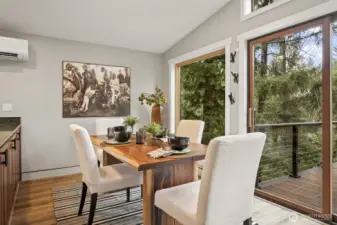 Enjoy meals in the bright dining space just off the kitchen with peaceful surrounding views.