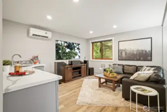 Lower-level mini suite offering flexible space for multi-generational living, a home office, or media room.