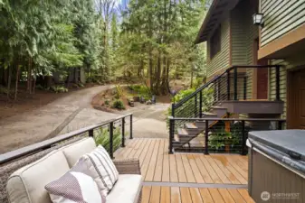 Spacious lower deck featuring a relaxing hot tub—perfect for unwinding.