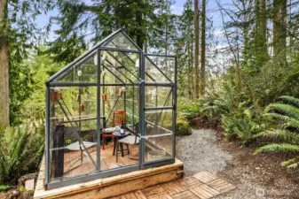 Charming, perfectly situated greenhouse ideal for gardening or a variety of uses.