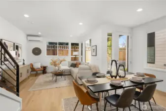 Neutral tones and a clean design allow the natural light to take center stage in this bright living area.