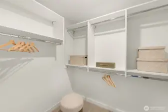 Indulge in the spa-like primary bathroom, complete with a contemporary dual vanity and elegant tile work.