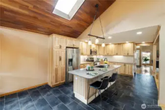 This space just begs for friends to hand out, eith at the breakfast bar or in the small eat-in dining space.  And, know cold toes in the damp, cool PNW gray.  Those ceramic tiles hide heated floors!  Woo-hoo! The wood ceiling makes it all feel cozy, too.