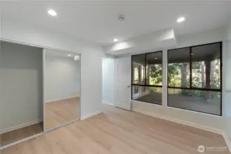 There is a spacious bedroom, with a full closet and windows to the covered patio.