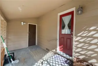 Two step covered access from main floor mudroom/laundry to the garage.