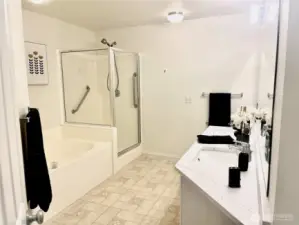 Primary bathroom w/ large shower, big soaking tub & dual sink vanity with new quartz counters & undermount sinks