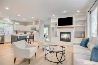Beautiful family room open to the big kitchen. Updated fireplace wall with built-in bookcases, stone fireplace wall with wood mantle.