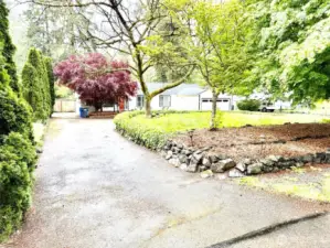 Exit from loop driveway. RV parking on the side.