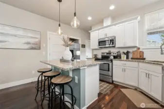 Timeless features like white cabinets and granite countertops.