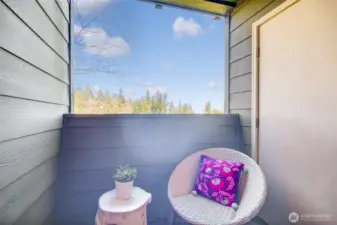 The balcony looks out to the lake, mountains, trail and has storage