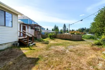 Backyard and deck off rear of home.