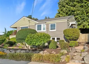The verdant front yard is terraced and planted with drought resistant landscaping. The new landscape lighting makes the place come alive at night!